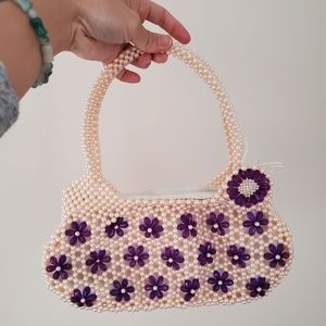 Pearly white beaded purse with purple flowers